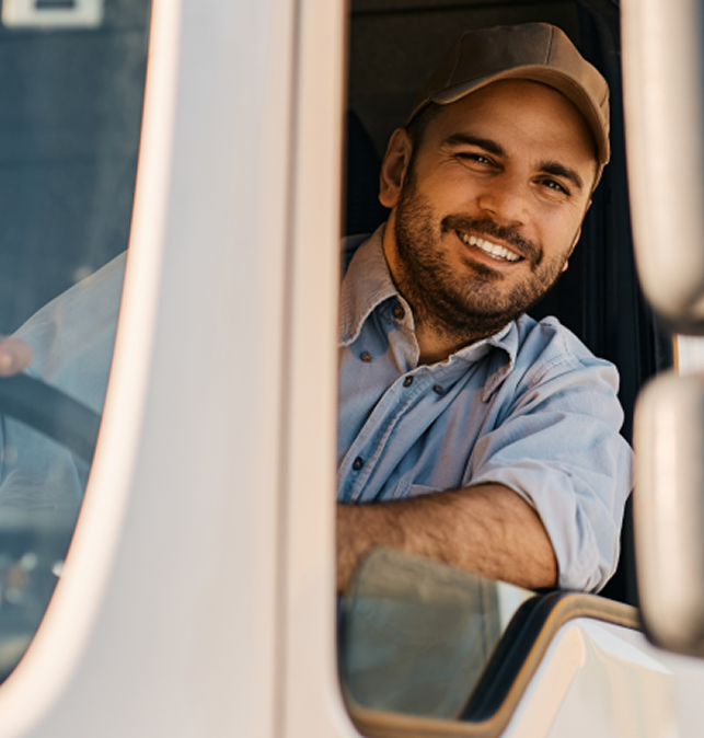 Smiling driver leaning out of the cab window